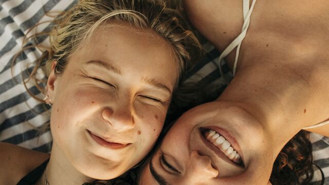 Two young woman at the beach - small